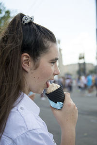 Close-up of young woman eating ice cream