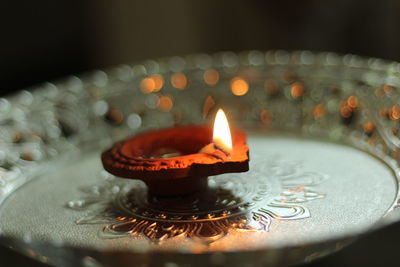 Close-up of burning diya