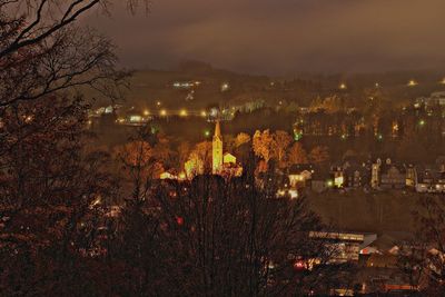 High angle view of illuminated buildings in city at night