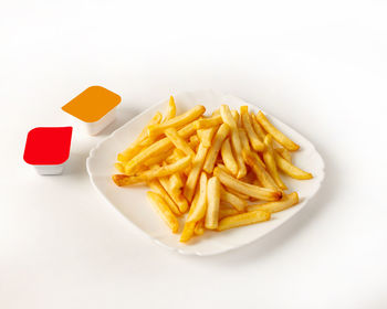 High angle view of pasta served on white background