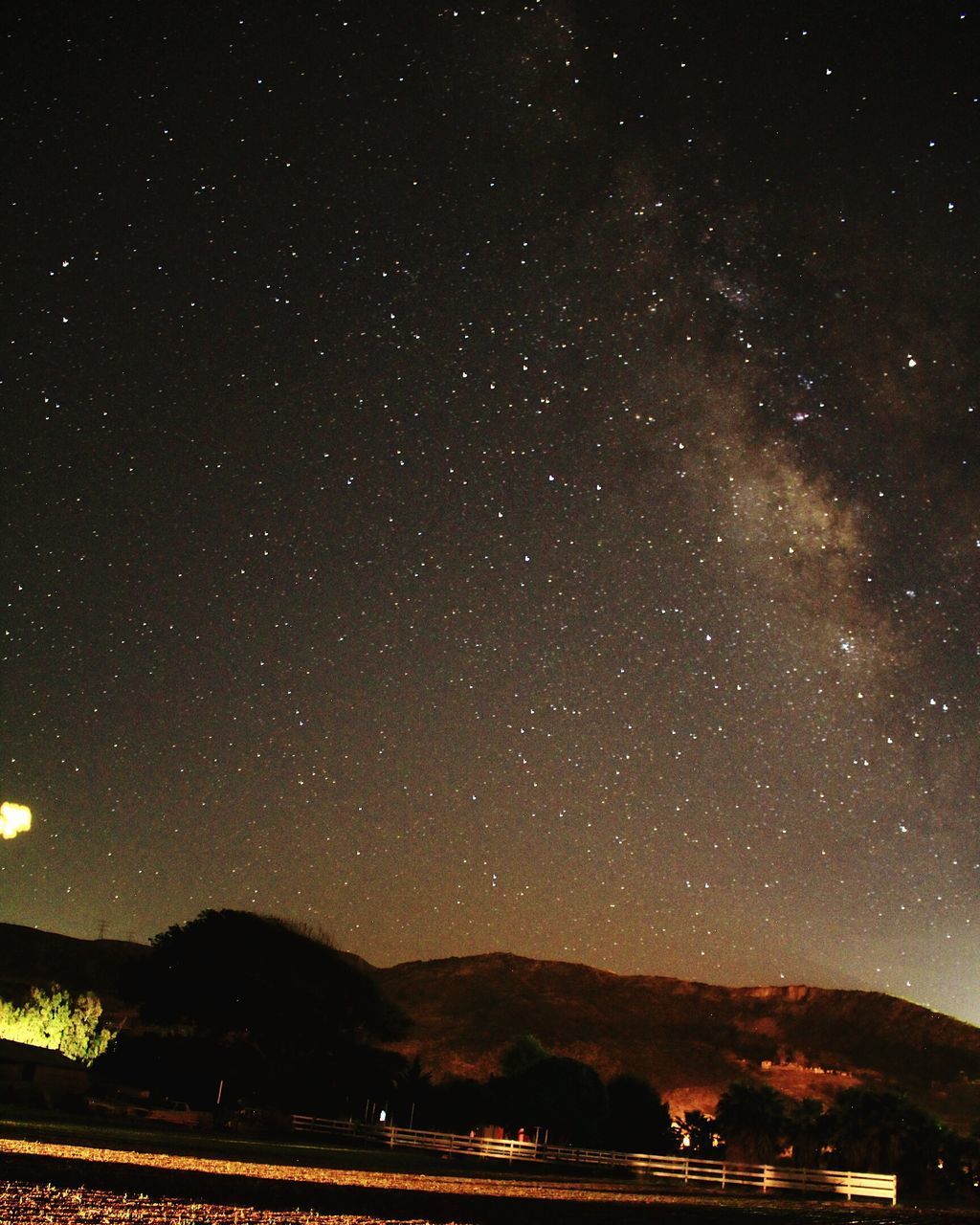 SCENIC VIEW OF MOUNTAIN AGAINST SKY AT NIGHT