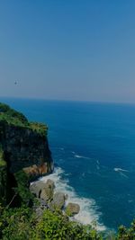 Scenic view of sea against clear blue sky in gunung kidul central java