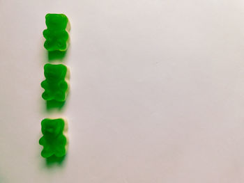 High angle view of candies against white background