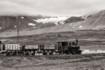 Abandoned mining railway steam locomotive at svalbard coast