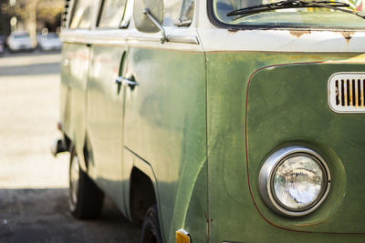 Green van parked on road