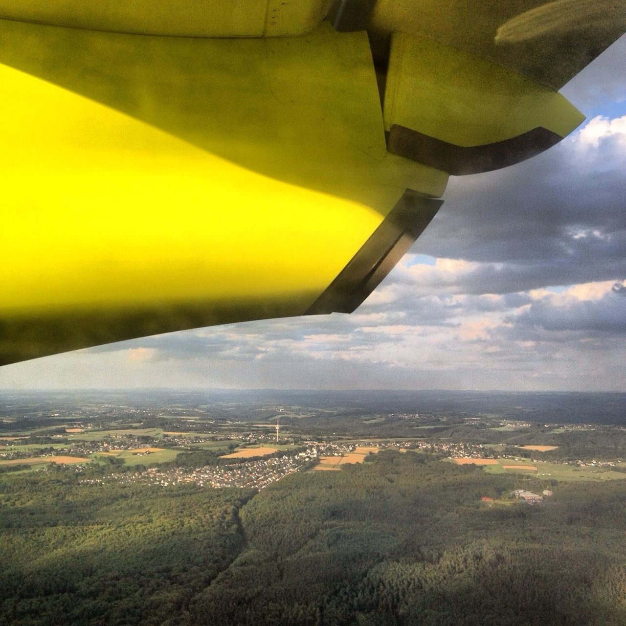 transportation, landscape, airplane, air vehicle, sky, flying, aircraft wing, aerial view, cropped, mode of transport, travel, part of, scenics, mid-air, built structure, nature, beauty in nature, rural scene, architecture, field