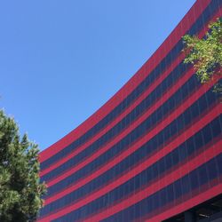 Low angle view of built structure against clear blue sky