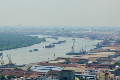 High angle view of buildings and city against sky