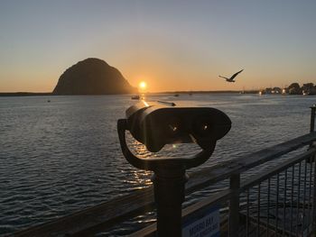 Scenic view of sea against clear sky during sunset