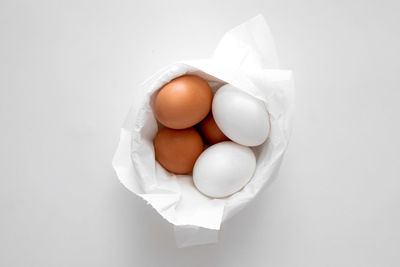 High angle view of eggs on white background