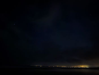Scenic view of sea against sky at night
