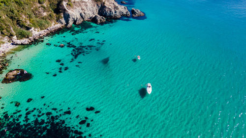 High angle view of rocks in sea