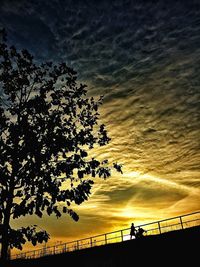 Low angle view of cloudy sky at sunset