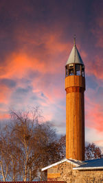 Low angle view of lighthouse against sky during sunset