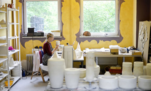 Woman working in porcelain workshop