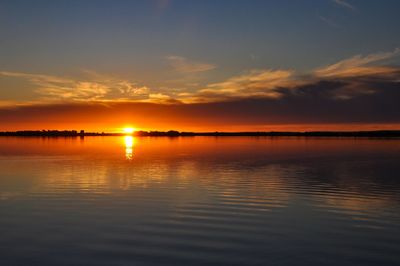 Scenic view of sea against romantic sky at sunset