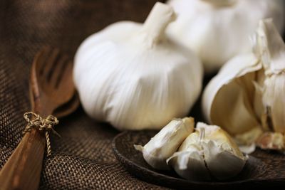 Close-up of white garlic on table