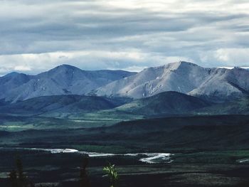Scenic view of snowcapped mountains against sky