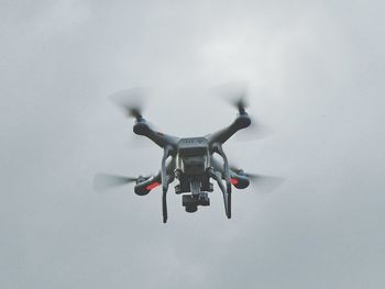 Low angle view of airplane flying in sky