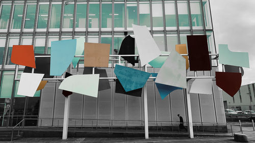 Clothes drying on railing against buildings in city