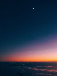 Scenic view of landscape against sky at sunset