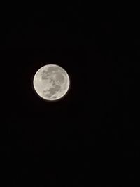 Low angle view of moon against sky at night