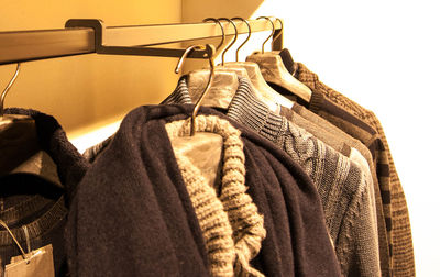 Close-up of clothes hanging on store