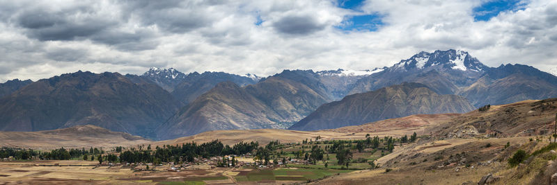 Scenic view of landscape and mountains against sky