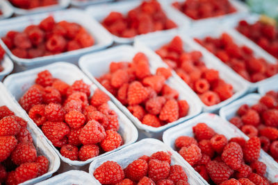 Close-up of raspberries for sale in containers
