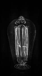 Close-up of colored object over black background