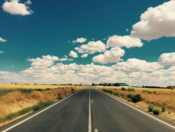 Road amidst landscape against sky