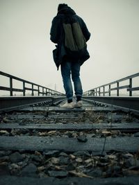 Full length of woman walking on bridge