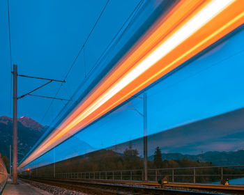 Blurred motion of train against blue sky