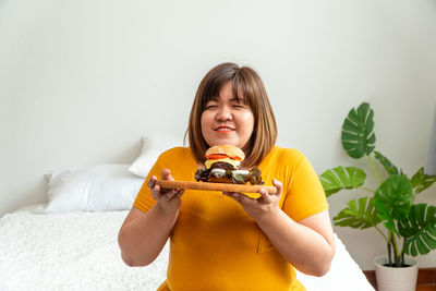 Portrait of a smiling girl holding ice cream