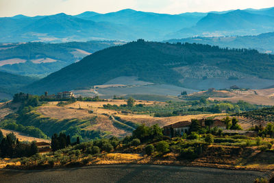 Scenic view of landscape and mountains against sky