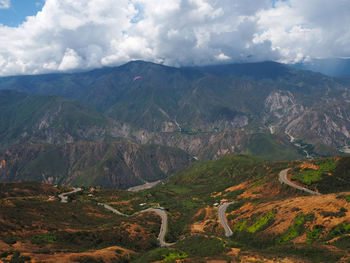 High angle view of mountain roads against cloudy sky