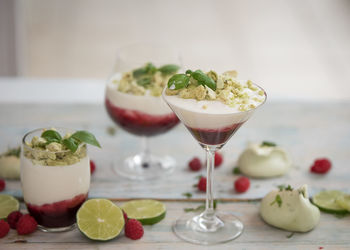 Close-up of drinks on wooden table