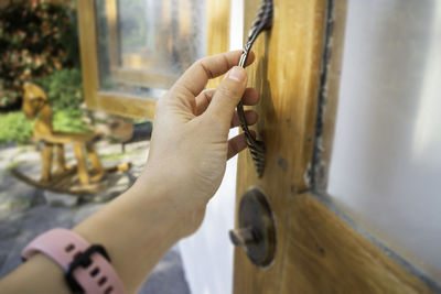 Midsection of person holding painting