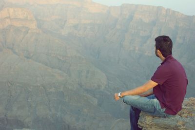 Man sitting on mountain