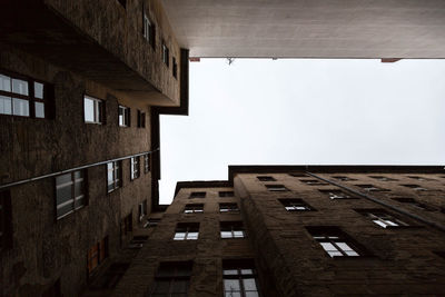 Low angle view of buildings against clear sky