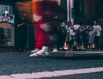 People walking on street in city