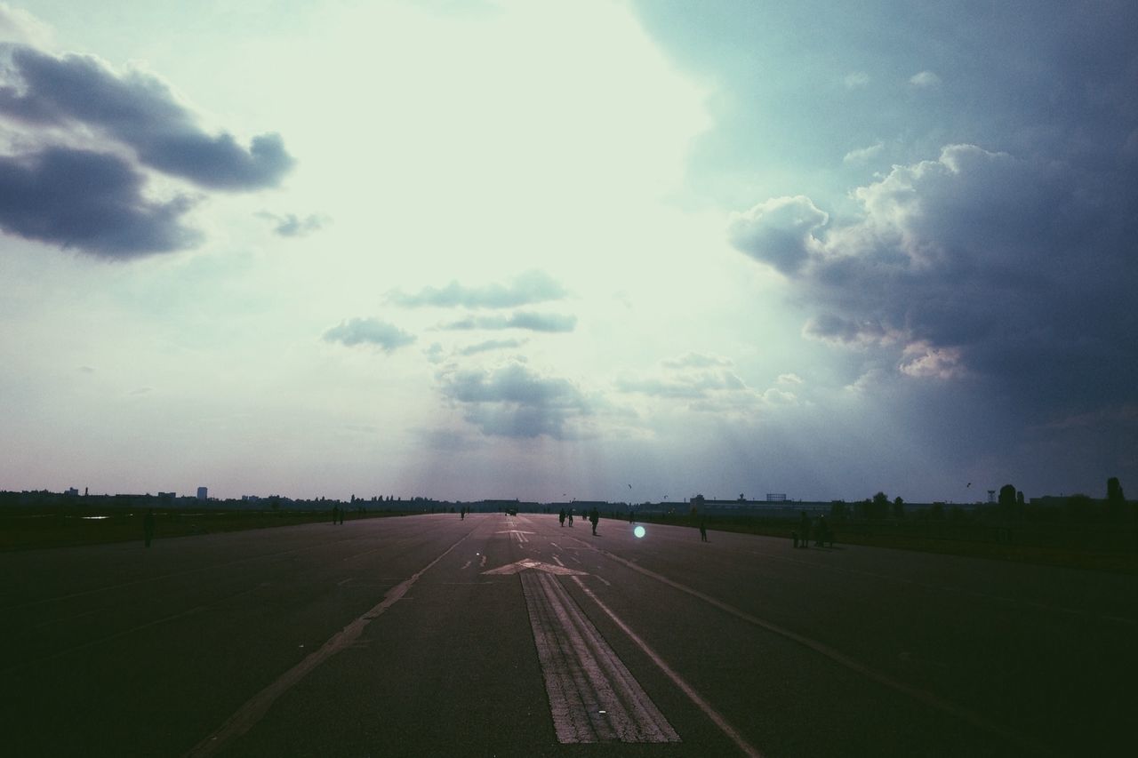 transportation, the way forward, road, road marking, sky, vanishing point, diminishing perspective, cloud - sky, cloudy, landscape, country road, street, cloud, highway, empty, empty road, nature, tranquility, outdoors, no people