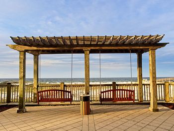 Built structure on beach against sky