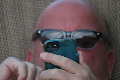 Cropped image of man using mobile phone