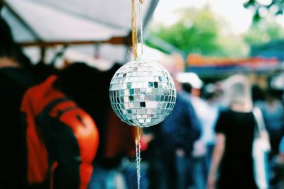 Close-up of disco ball hanging at market stall