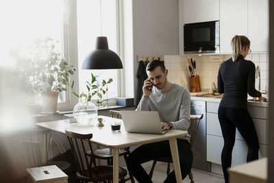 Couple in kitchen