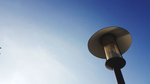 Low angle view of street light against sky