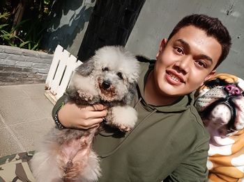 Portrait of smiling man with dog