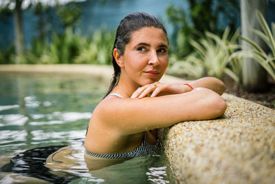 Portrait of young woman in swimming pool
