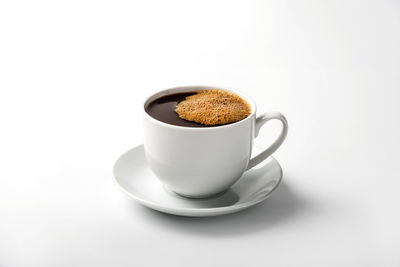 Close-up of coffee cup against white background